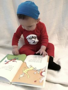 Toddler reading on Read Across America Day