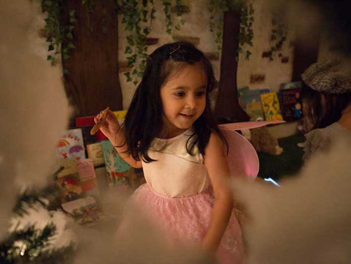Little girl with black hair in a pink tutu at Book Nook learning Center